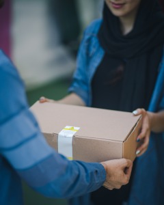person giving another person a parcel