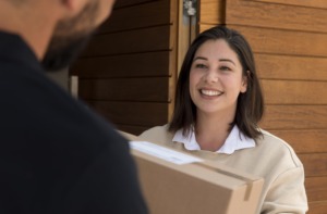 same day delivery woman getting package delivered