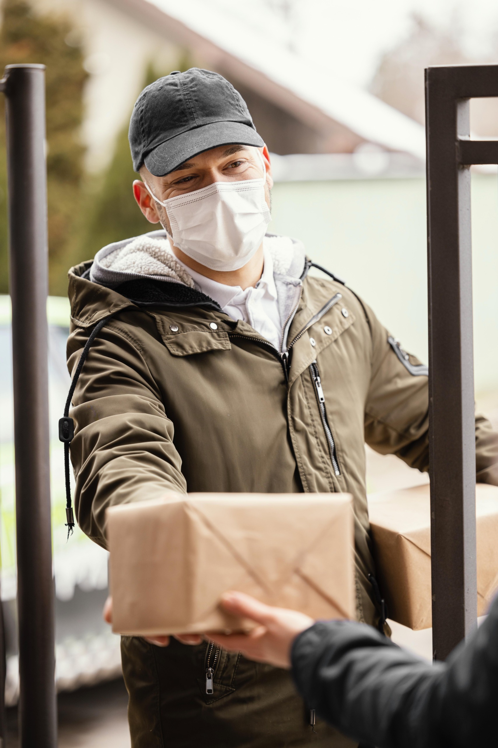 delivery-man-with-package-wearing-mask